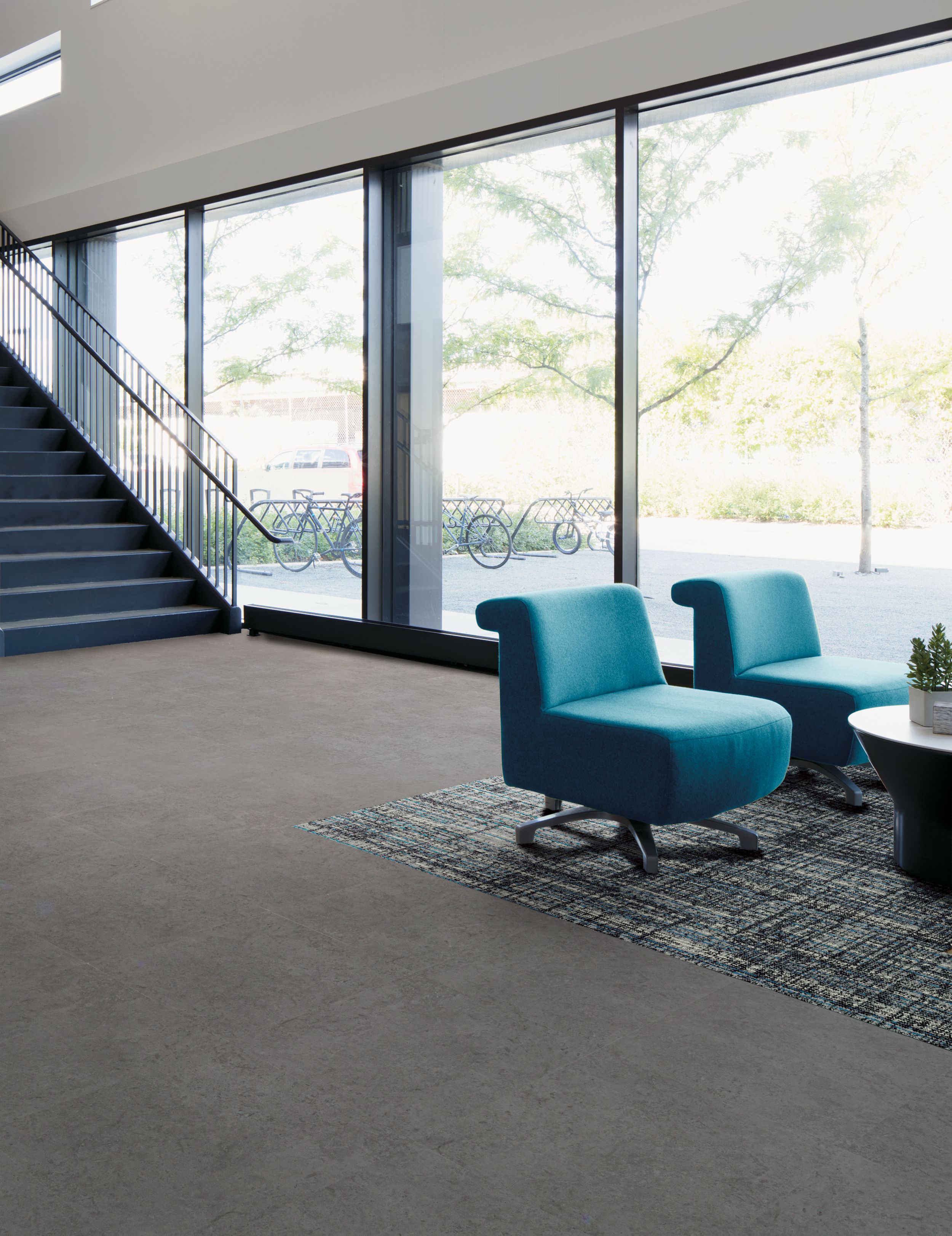 Interface Upload carpet tile and Textured Stones LVT in lobby area with chair image number 2